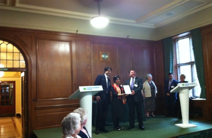 Lloyd receives his reward from Baroness Warsi and Lord Feldman.