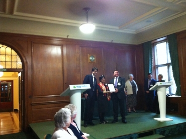 Lloyd receives his reward from Baroness Warsi and Lord Feldman.